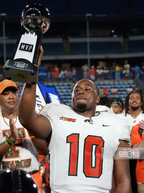 FAMU quarterback Daniel Richardson hoists the MVP trophy into the air after leading the Rattlers to a 24-23 win over Norfolk State in the season-opening MEAC-SWAC Challenge. (photo Jason McDonald, JM Photography)