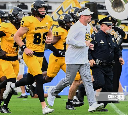 Kennesaw State head coach Brian Bohannon leads his team onto the field.